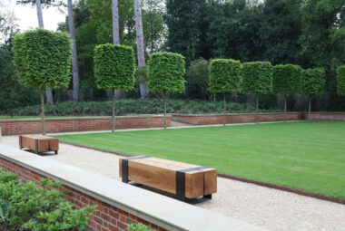 Harpsden Wood House bowling green with benches and cube head shaped trees