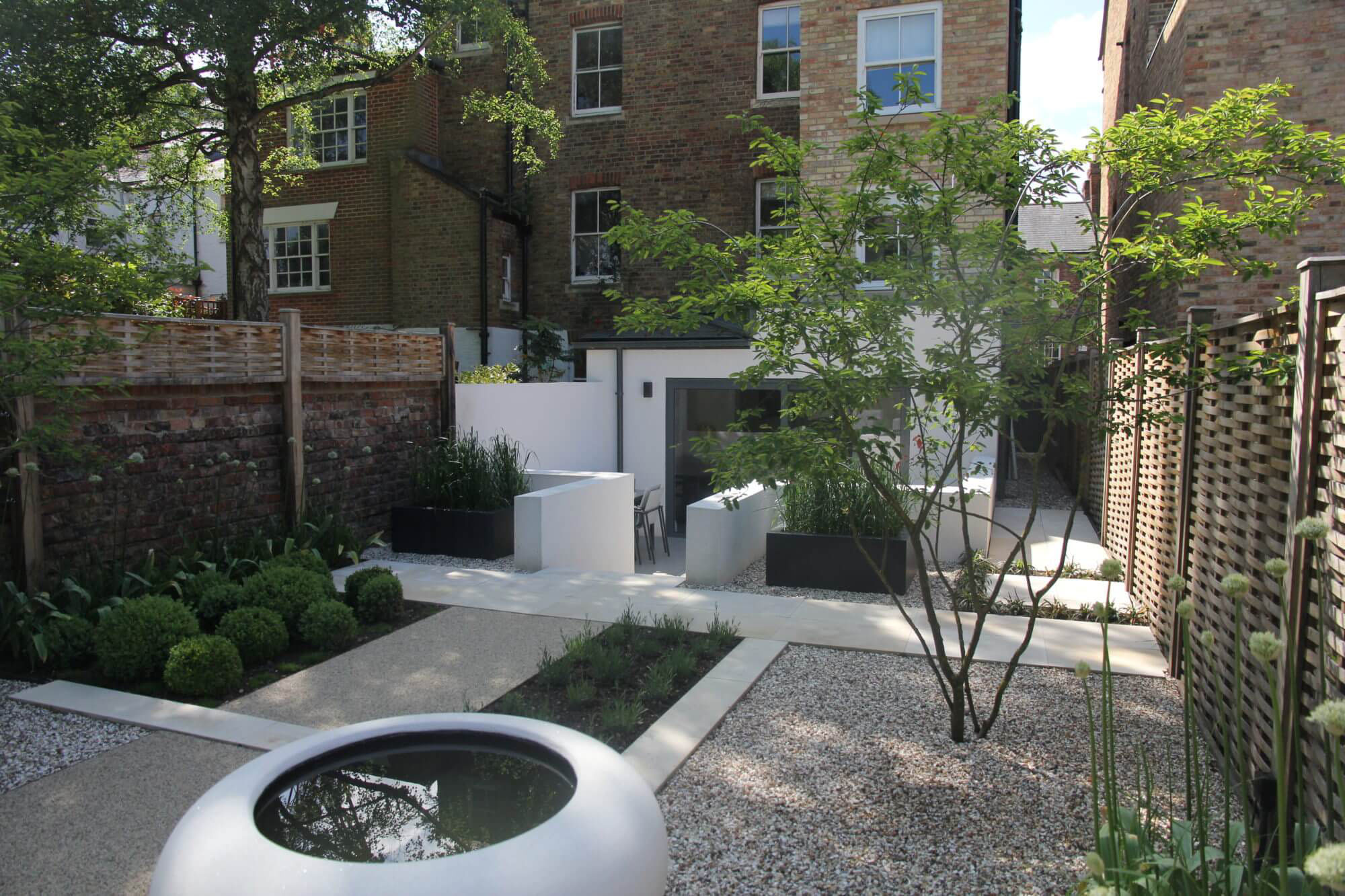 water bowl in an all white Oxford townhouse garden