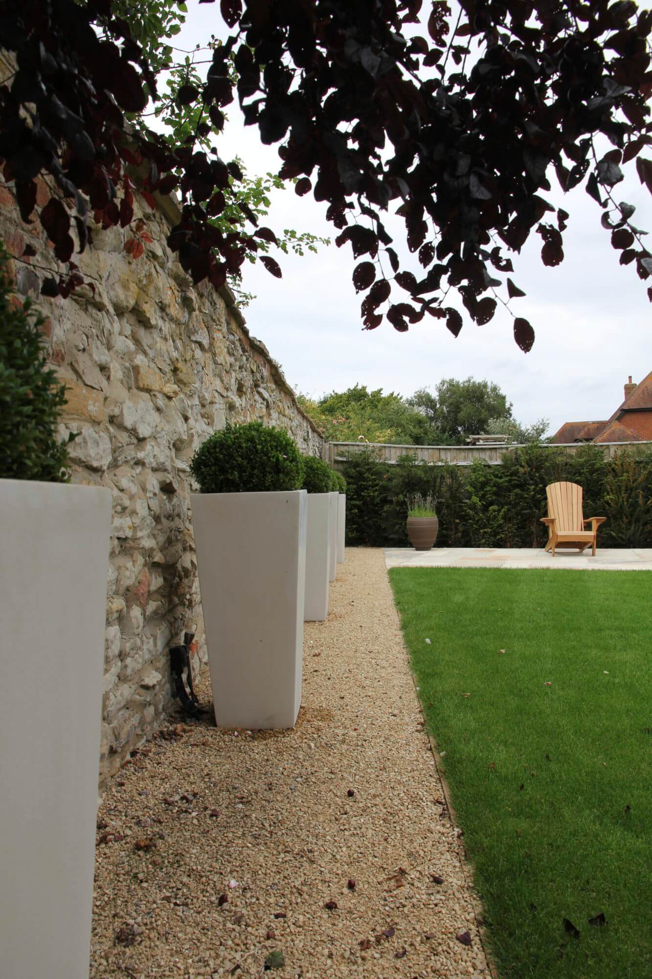 White ceramic cube planters with topiary ball