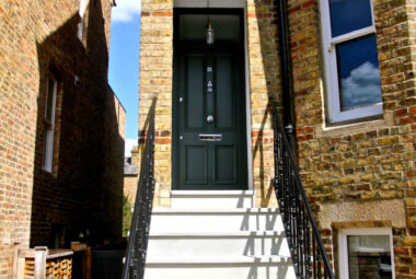 Stone steps and railings up to a Oxford townhouse garden