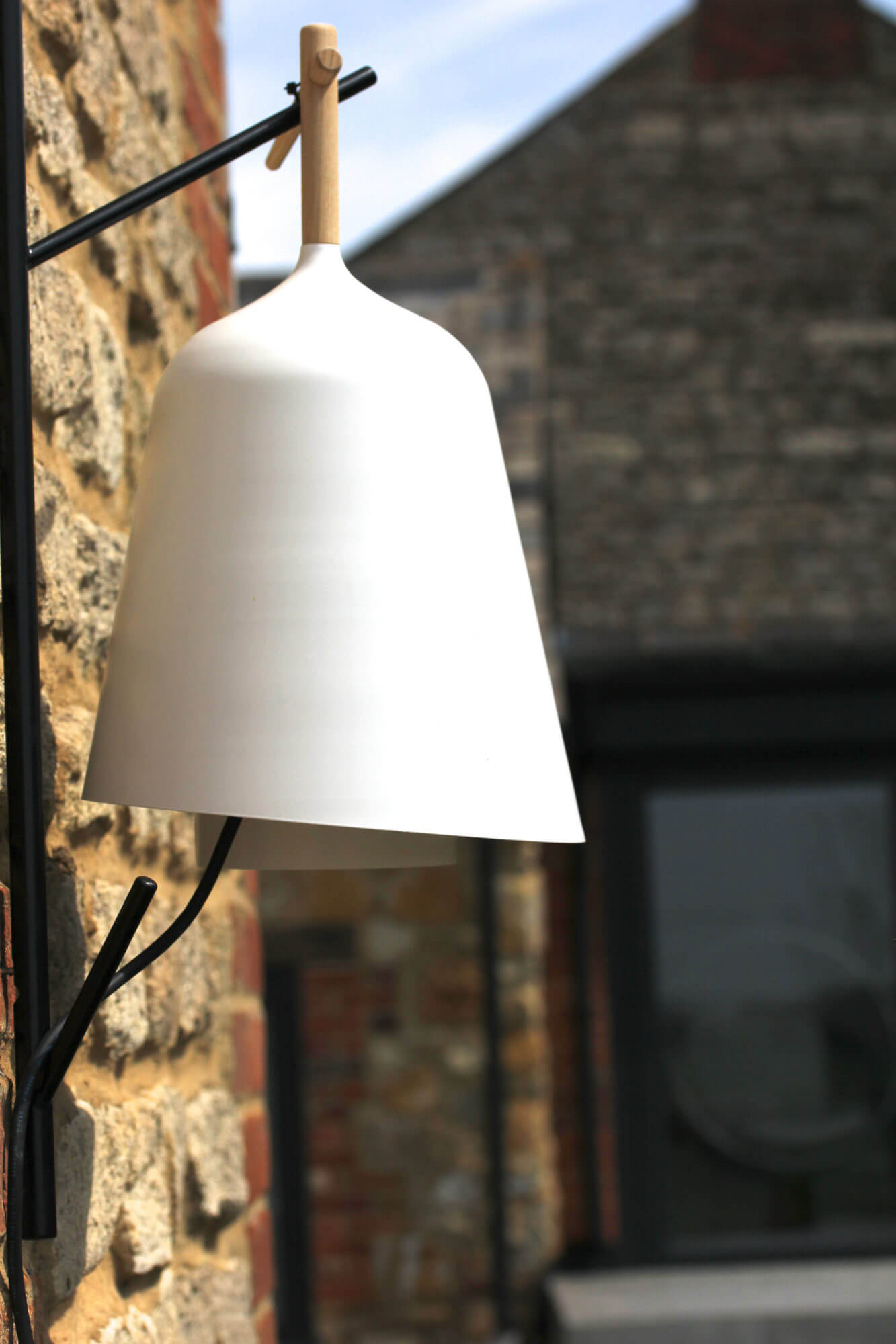 a scandinavian style white cowshed bell