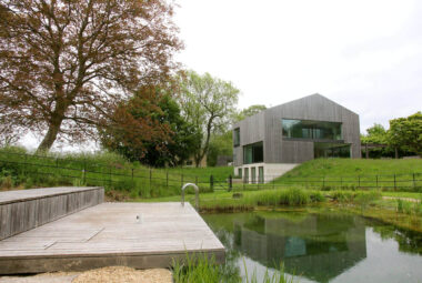 natural swimming pool and modern barn landscape