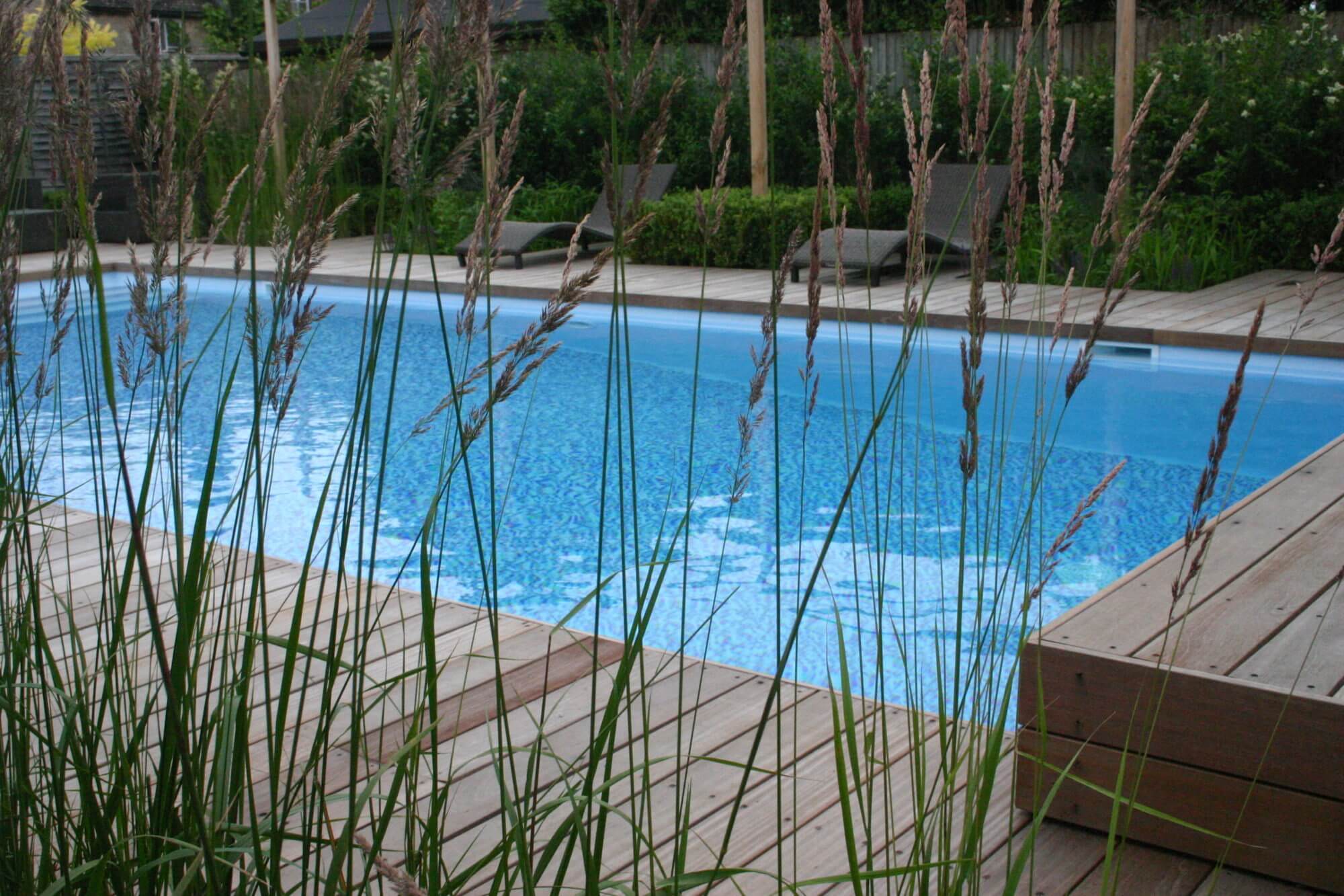 aqua blue cotswolds swimming pool and grasses