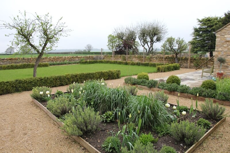 landscaped garden in kingfhaam lawn and trees and field