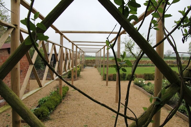 country pergola with hogging path