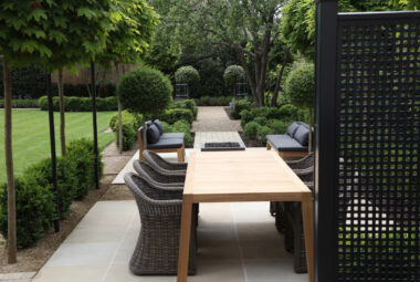 townhouse garden in Oxford dining table and chairs with topiary trees