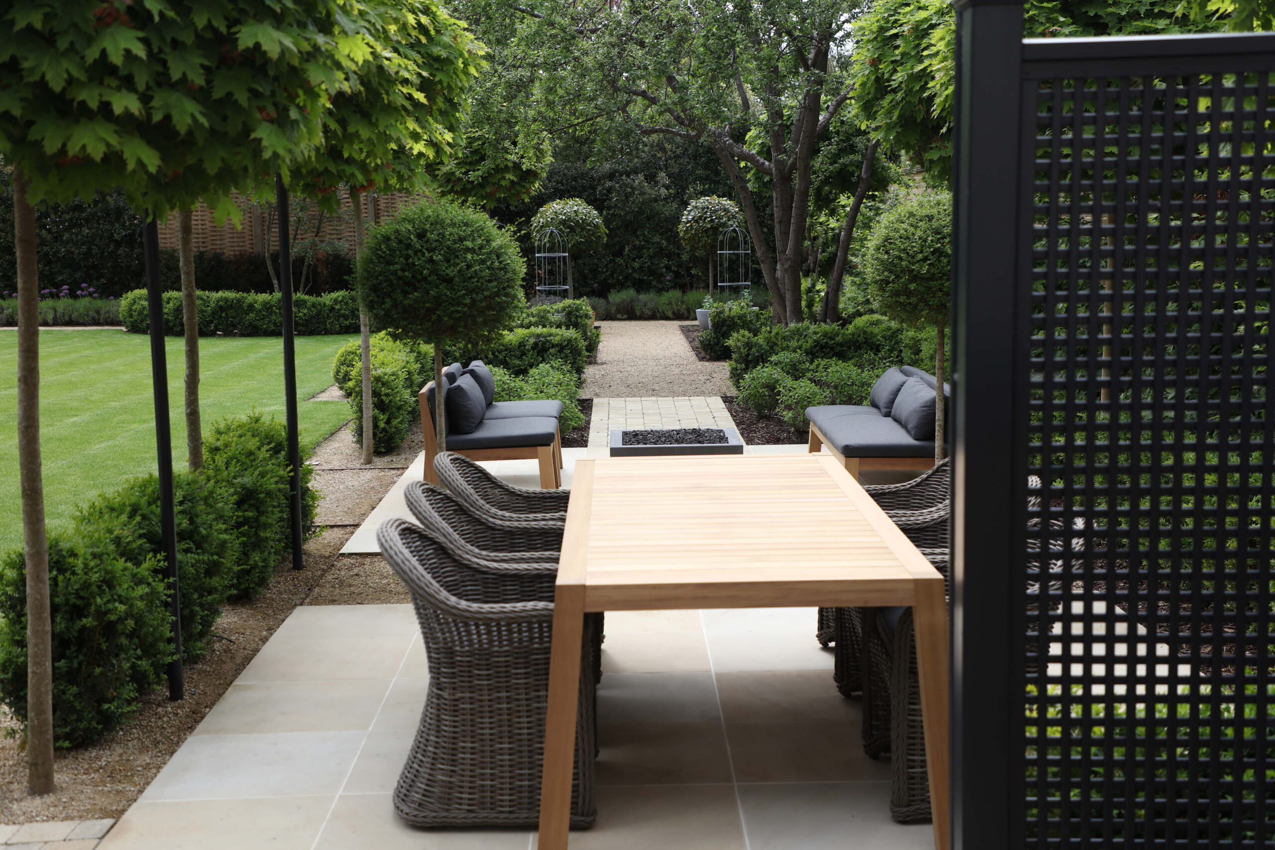 townhouse garden in Oxford dining table and chairs with topiary trees