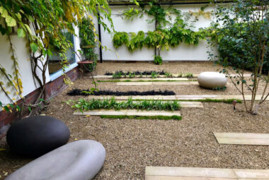 modern courtyard garden with giant pebbles by designers in Oxford