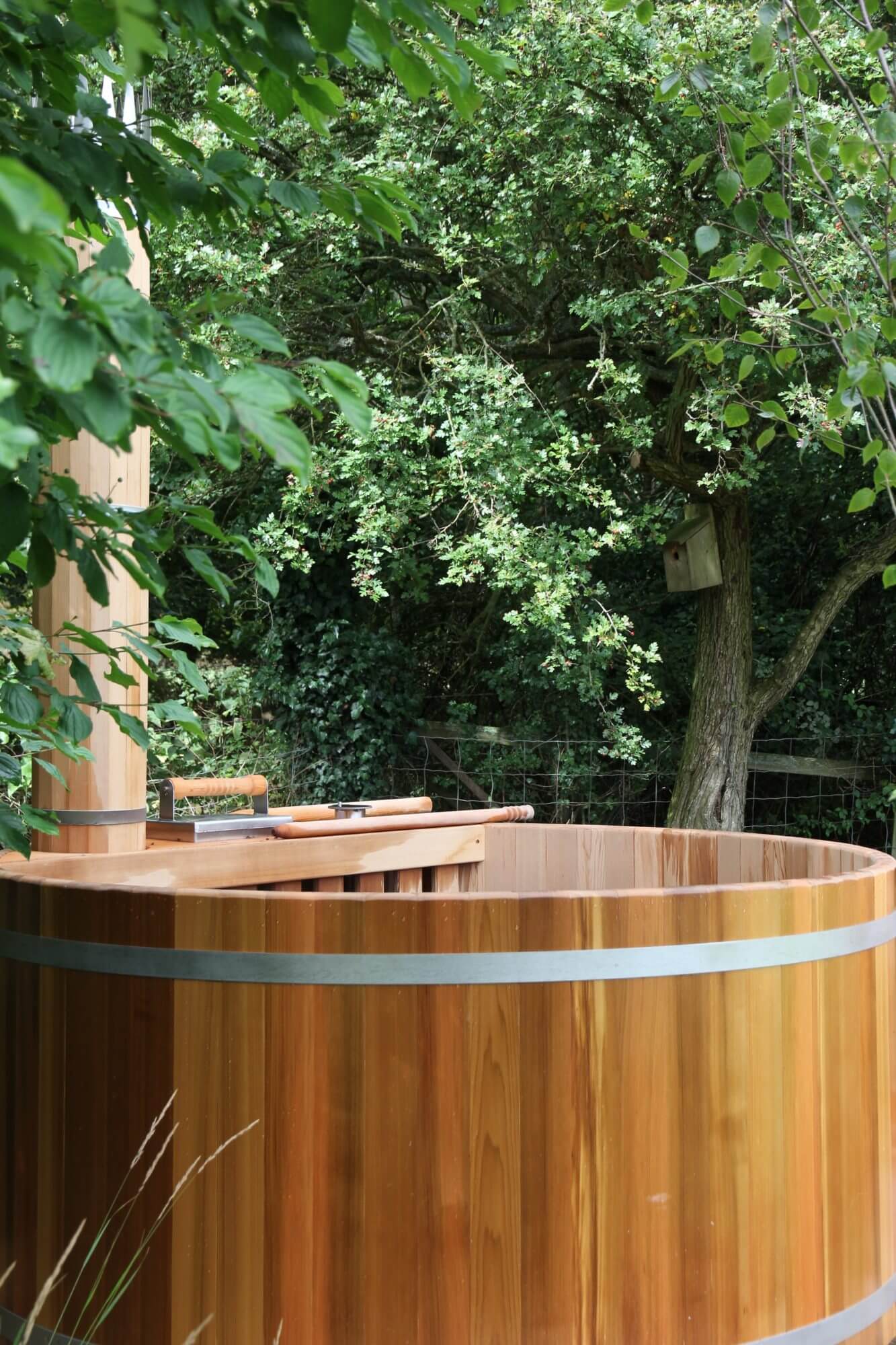 Woodfired hot tub in newly designed garden