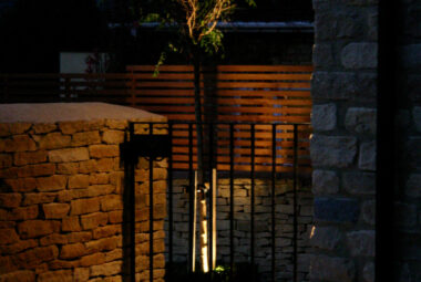 Pedestrian gate with lighting at night