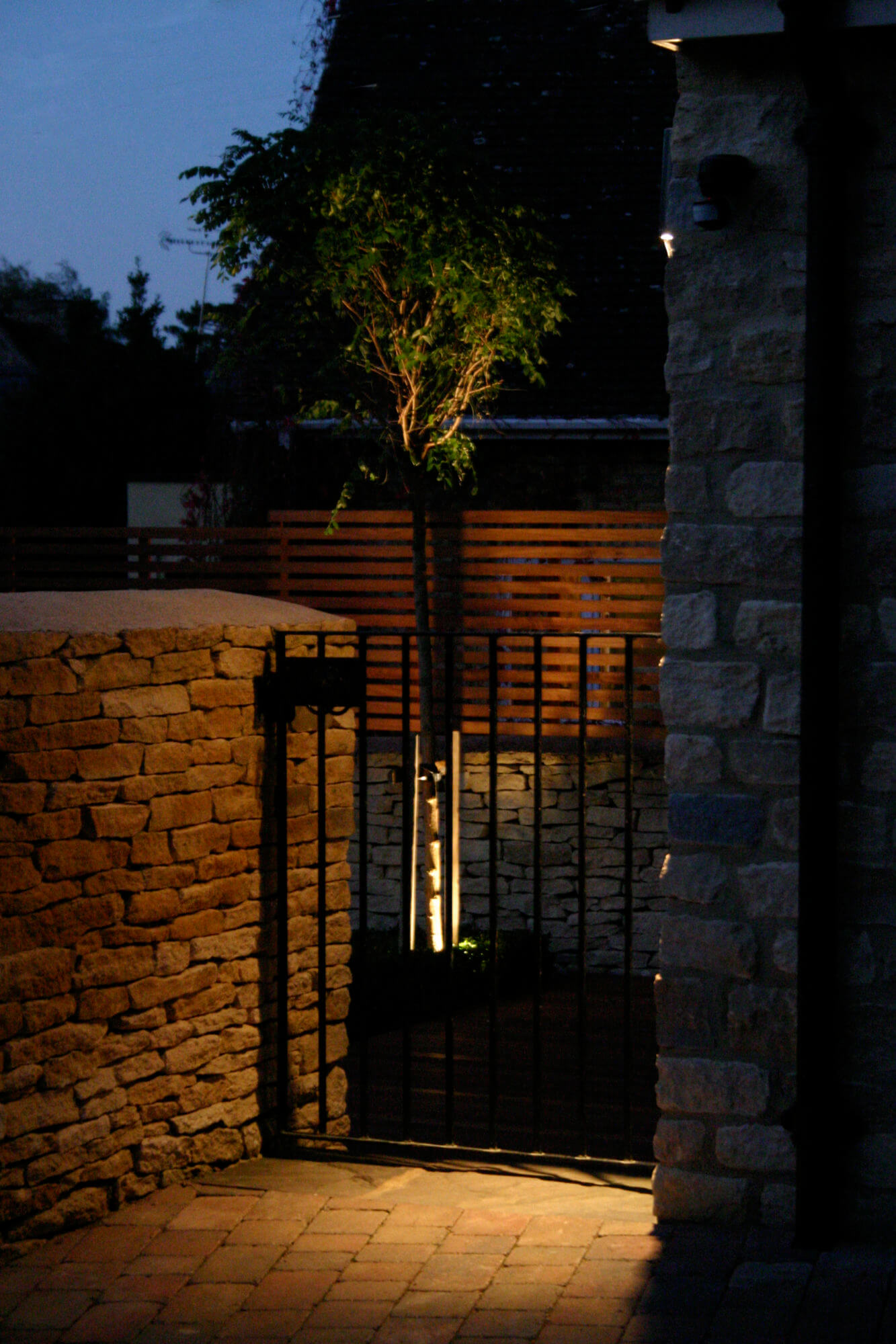 Pedestrian gate with lighting at night