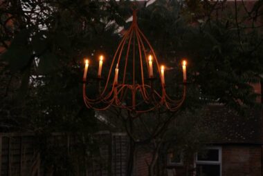 Garden at night with chandelier, fire pit and laterns