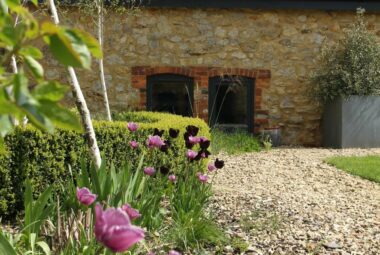 barn conversion garden Spring courtyard with Tulips