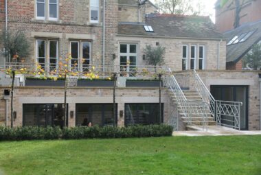 Norham gardens from the back steps with industrial handle bar and green lawn