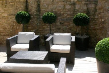 Garden seats with topiary balls