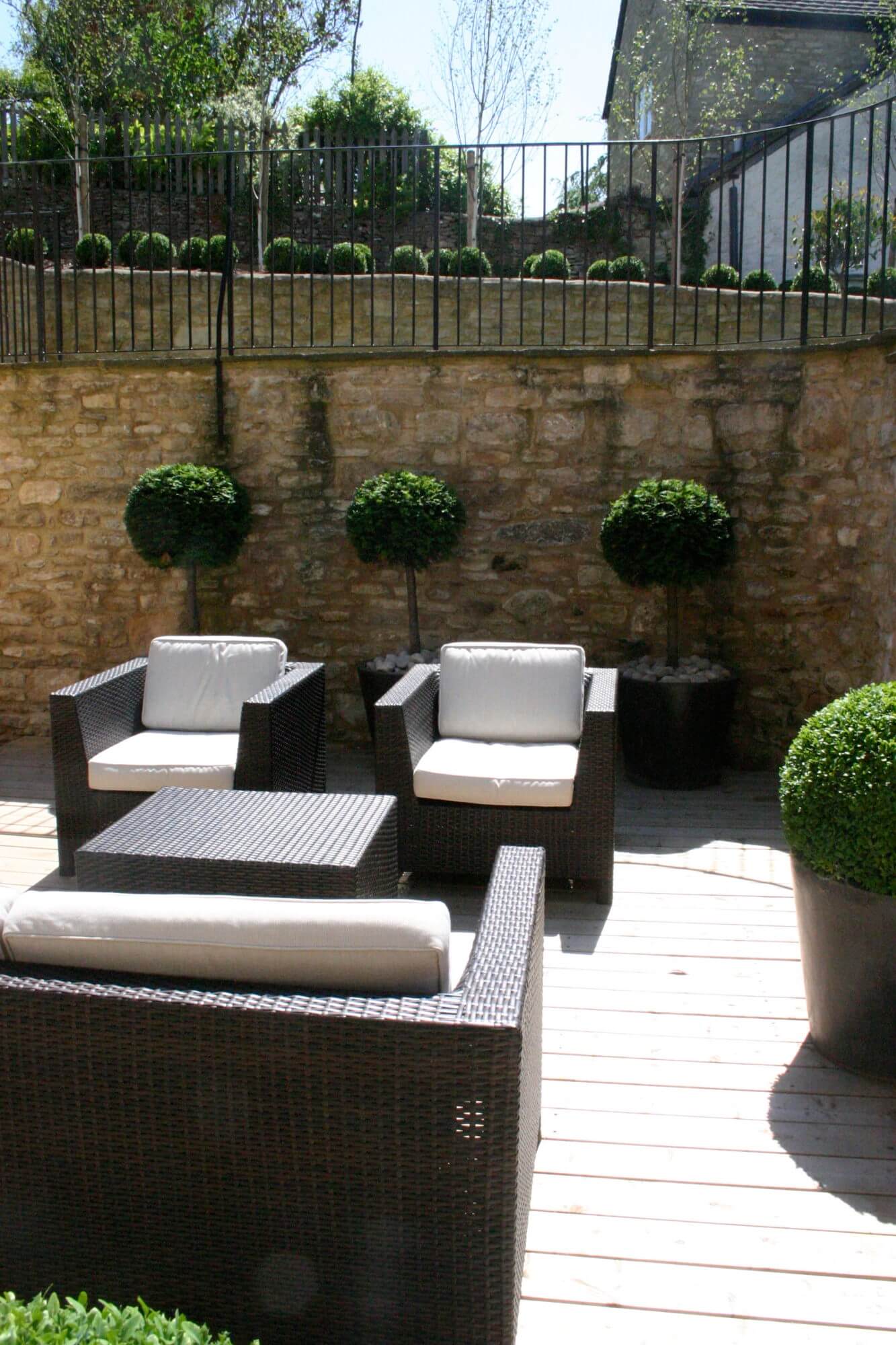 Garden seats with topiary balls