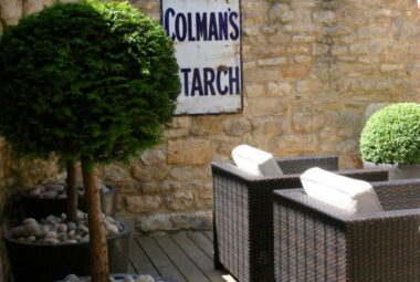 Vintage metal colmans sign on dry stone wall