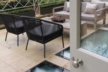 Rooftop terrace with glass floor and garden furniture