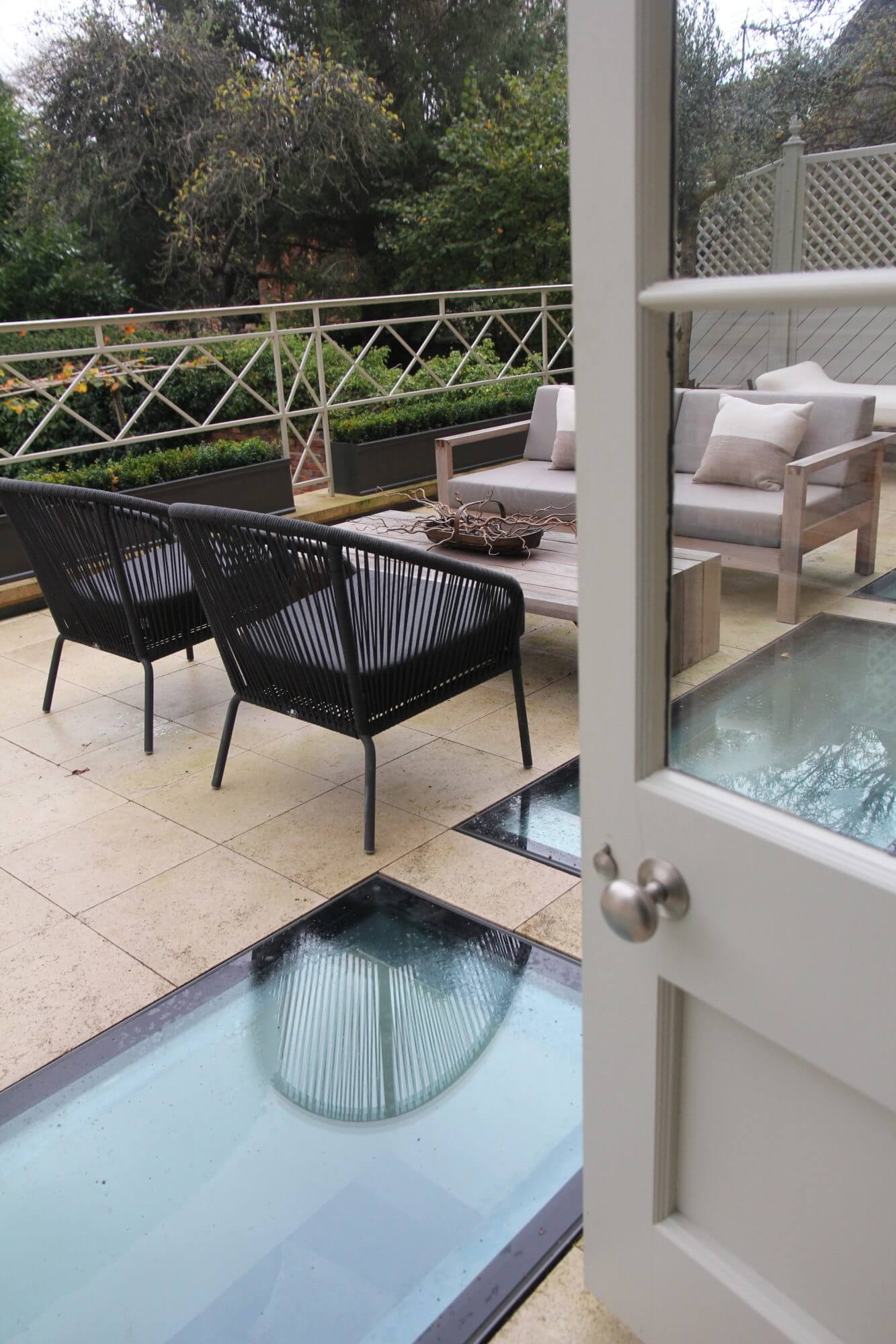 Rooftop terrace with glass floor and garden furniture