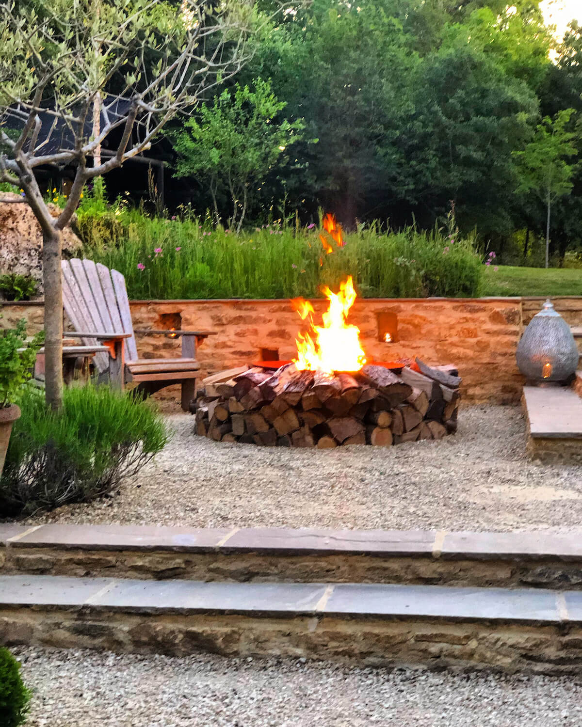 wildflower garden with terracing and a fire pit