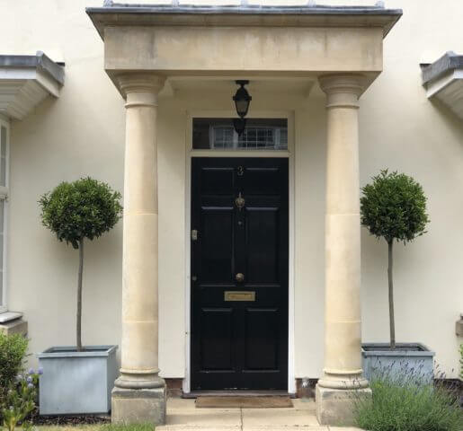 bay tree front garden with black door London