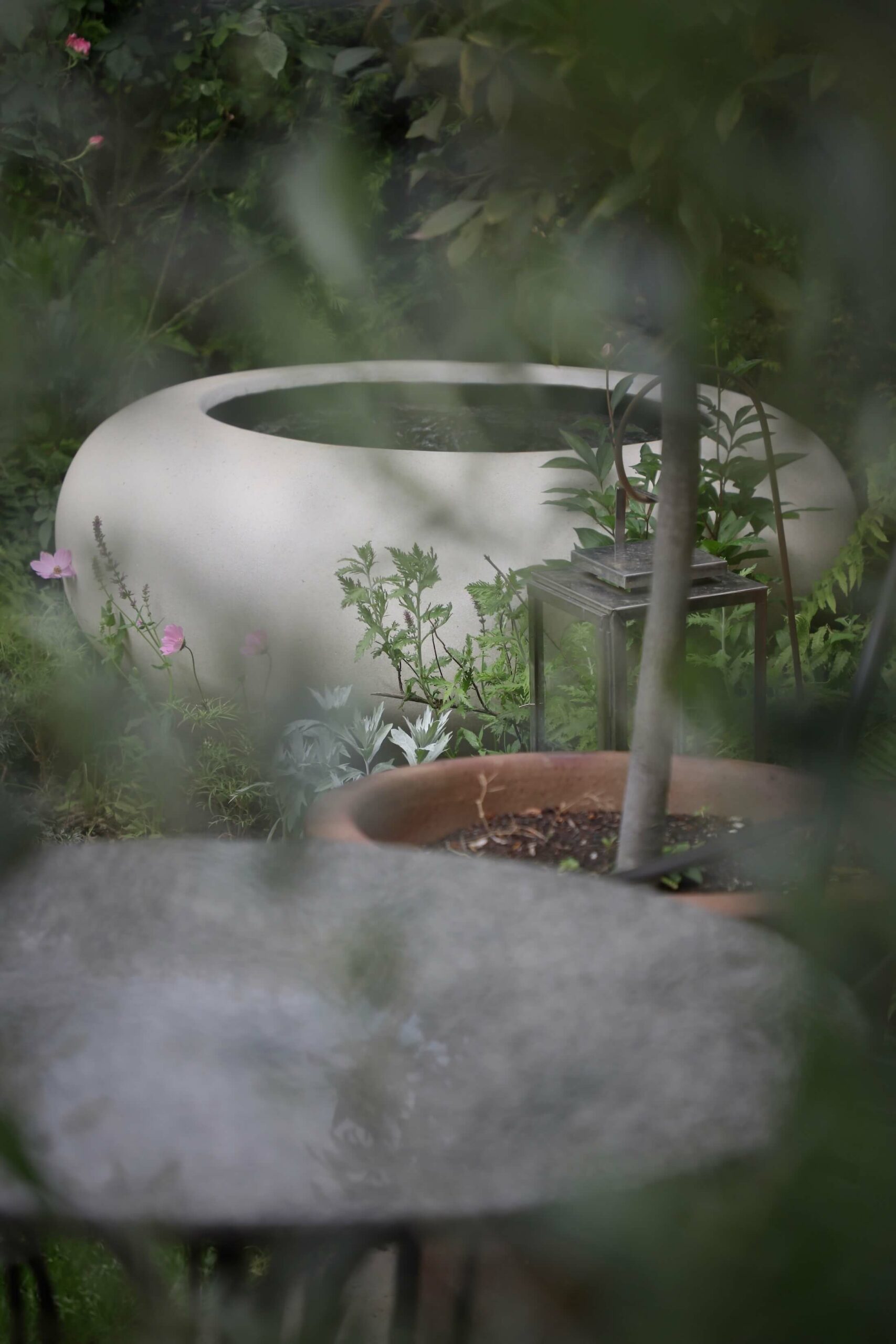 white garden water feature bowl and table