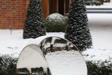 Round garden sculpture in artisan landscape