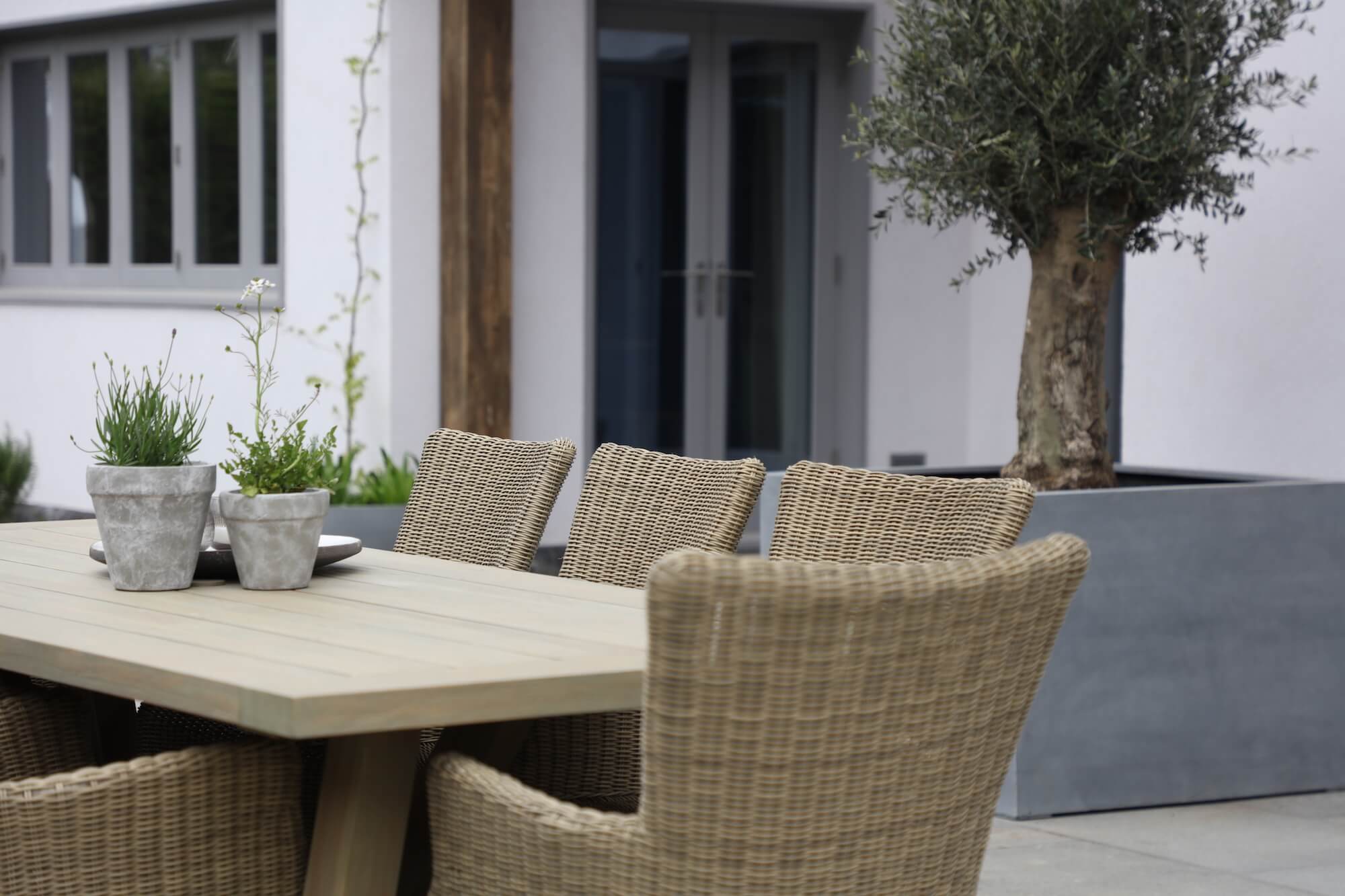 garden table with wicker chairs alfresco dining