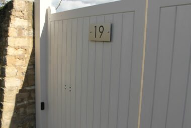 auto gates outside a townhouse painted in farrow & ball