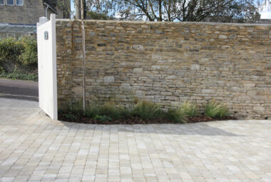 cotswold stone cobbled driveway and dry stone wall