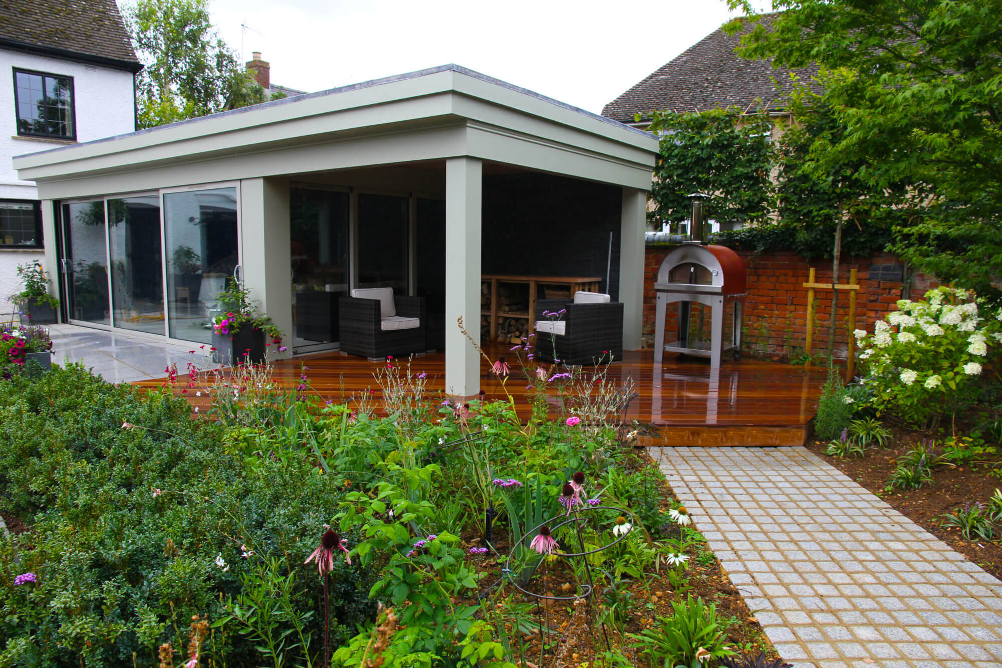 View of a garden cinema room with barbecue facilities