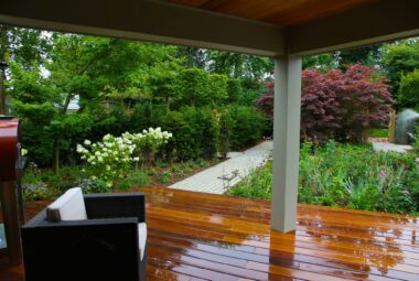 Garden check on wet wooden decking under shelter