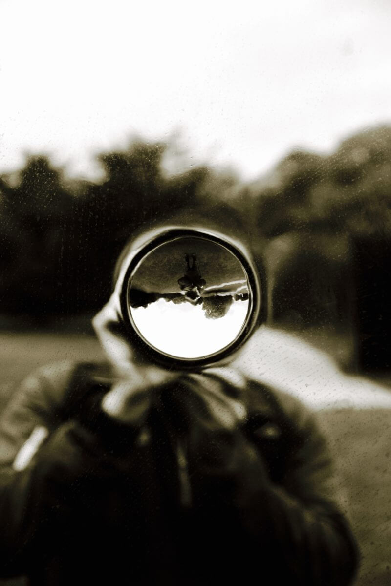 Designer looking through a camera lens in landscape design Oxfordshire