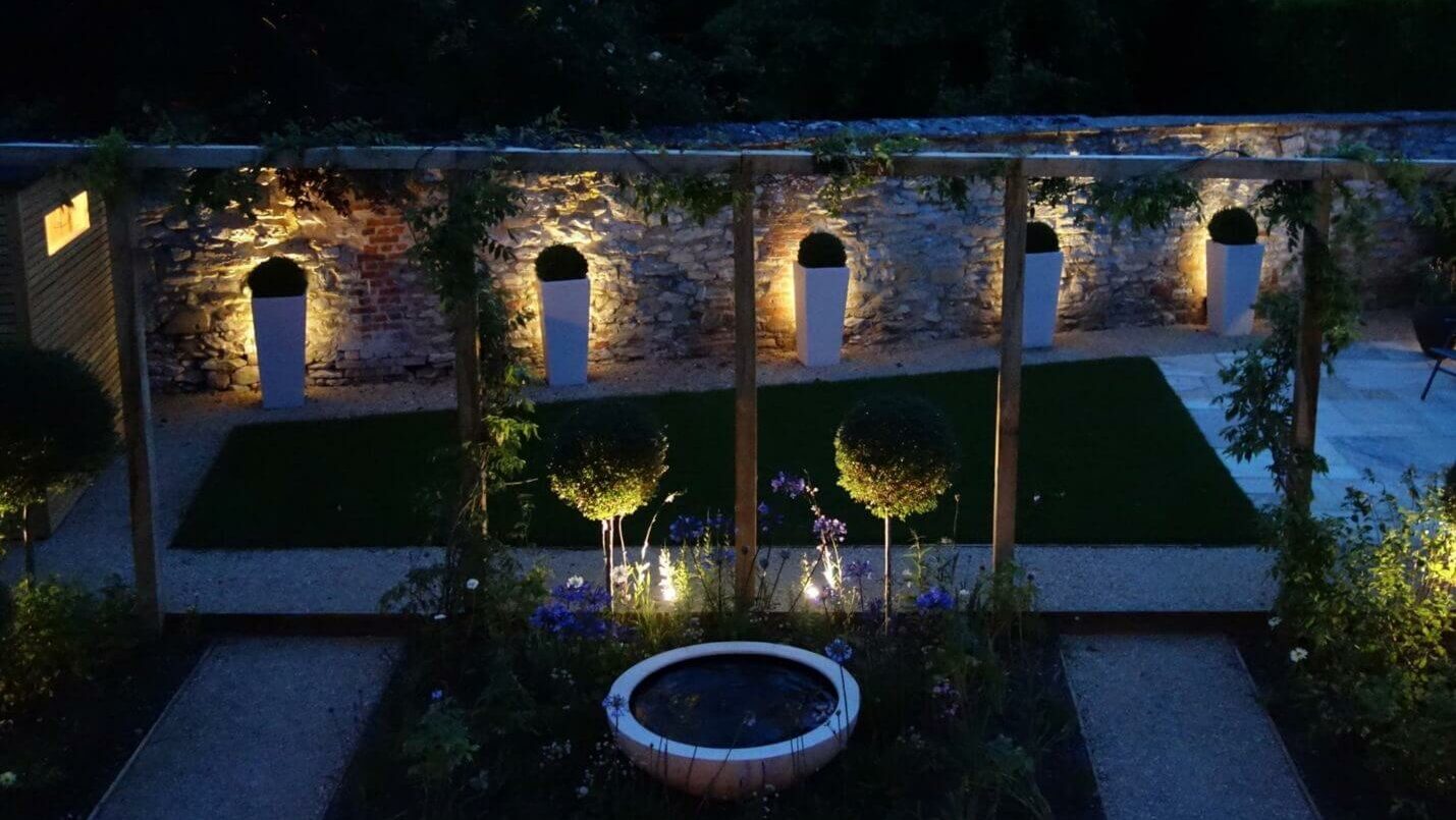 a Oxford garden with lighting at night