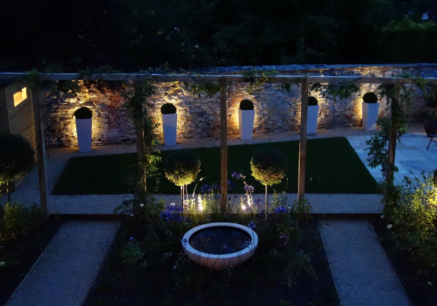 a Oxford garden with lighting at night