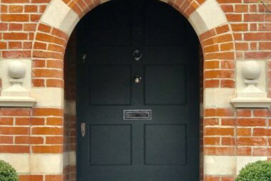 Oxford Victorian townhouse brick Homefront with bullnose steps and an archway door painted in Farrow & Ball Downpipe