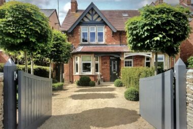 farrow & ball downpipe painted victorian town house in witney with topiary front garden