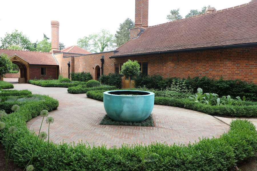 Harpsden Wood House in Henley-on-Thames grounds and gardens estate garden planting and water feature bowl in a productive garden