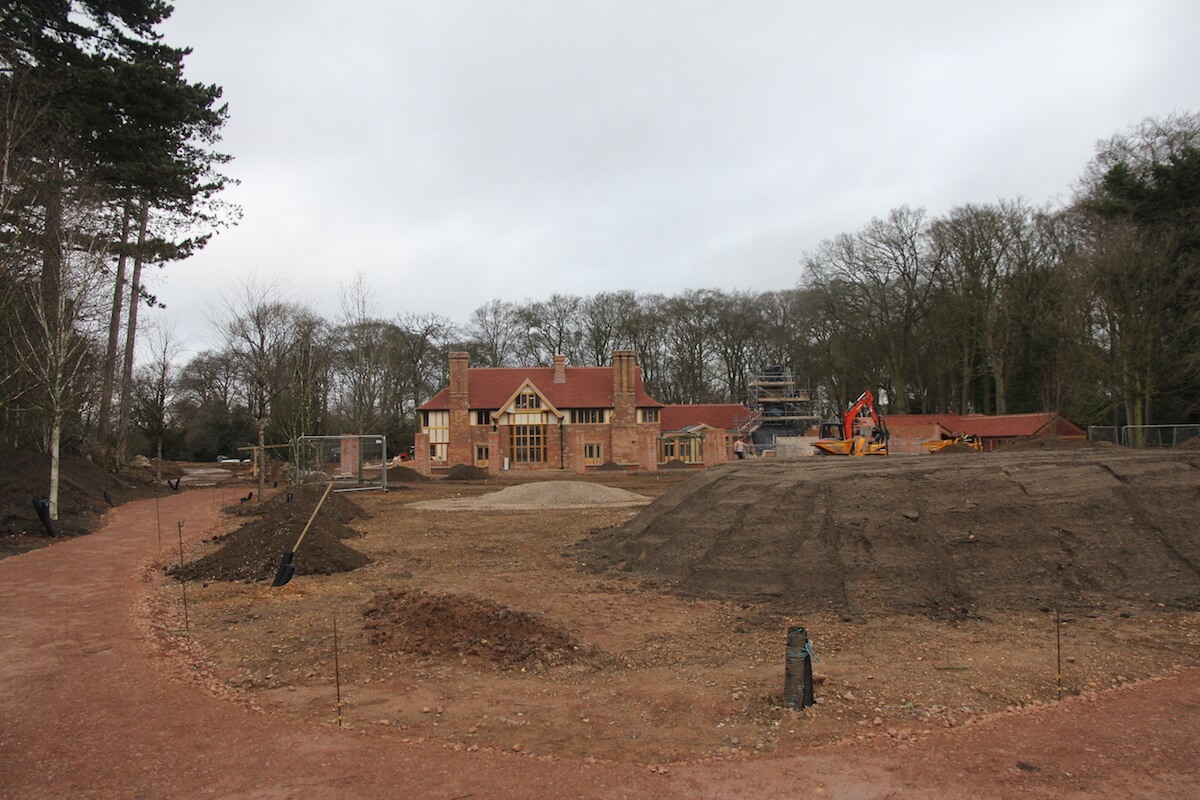 Harpsden Wood House, Henley-on-Thames grounds and gardens being landscaped with heavy machinery. Mounds of mud