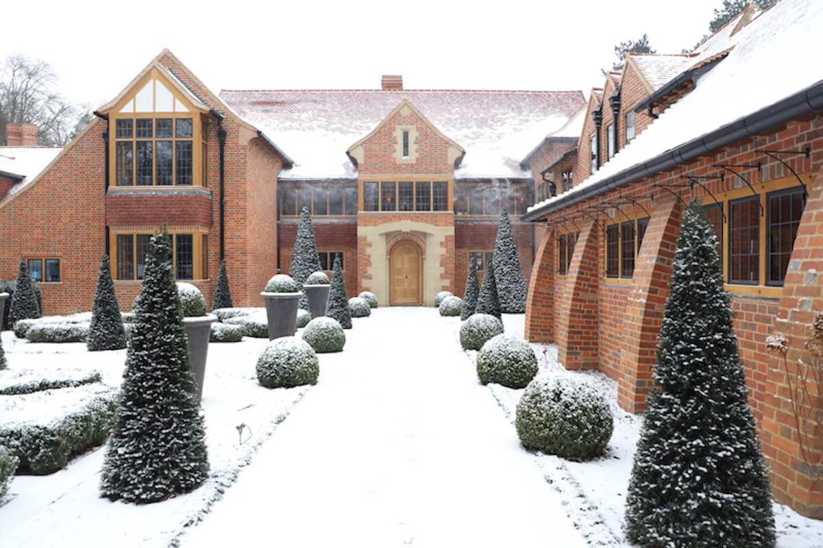 Harpsden Wood House in Henley-on-Thames grounds and gardens estate garden courtyard with topiary in snow