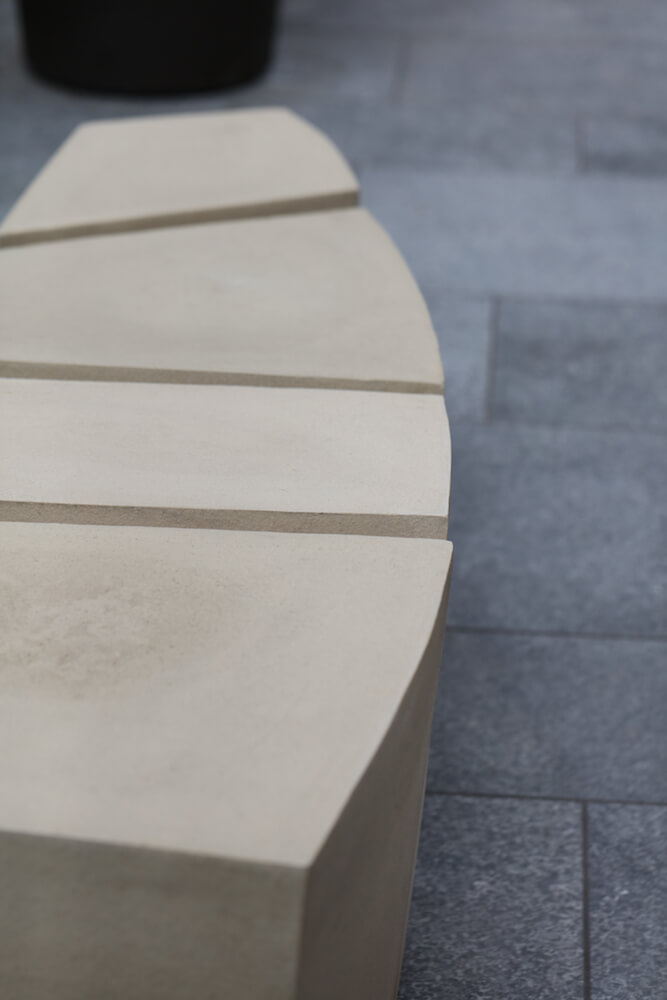 spine stone bench in a garden