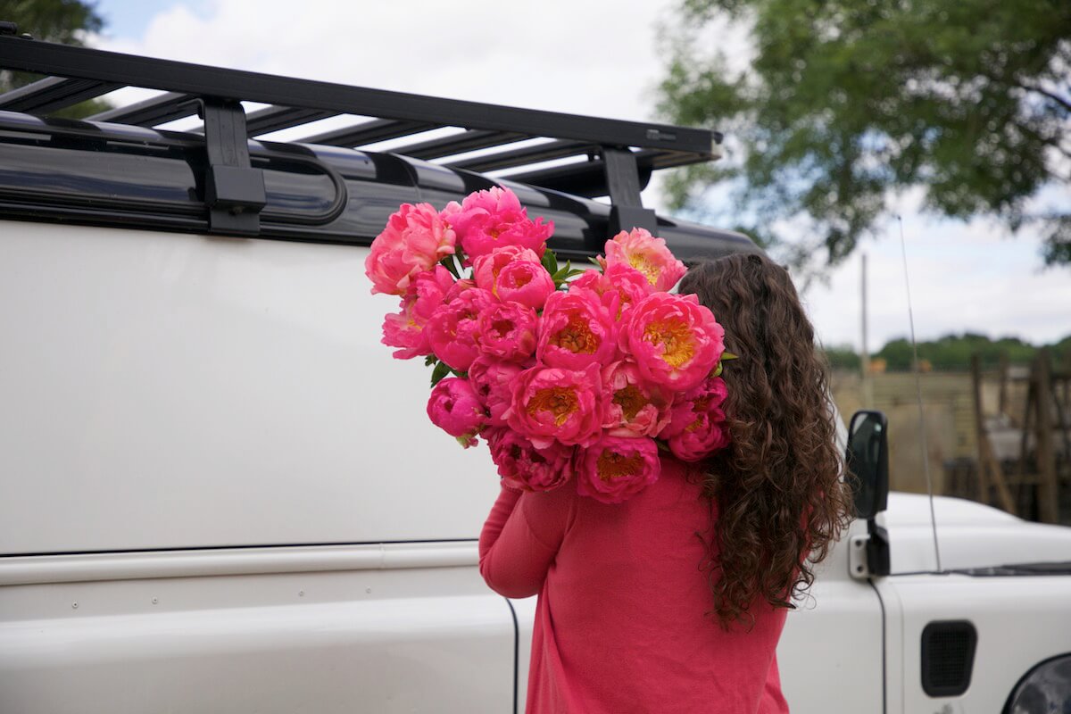 Floral Couture pink peonies in front of landrover