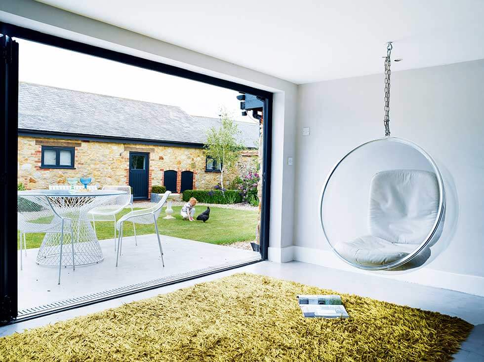 a bubble swing hating on a modern country living barn interior