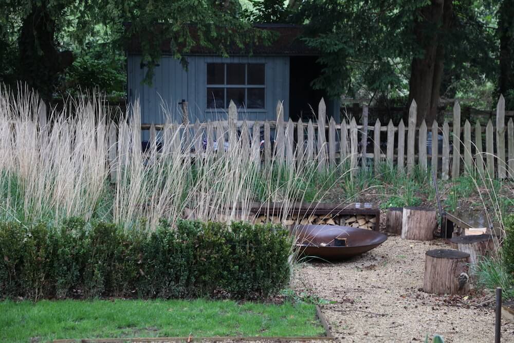 garden shack in blue with fire pit