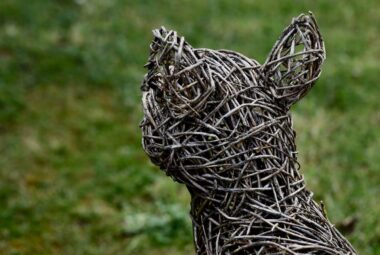 willow fox sculpture in a garden