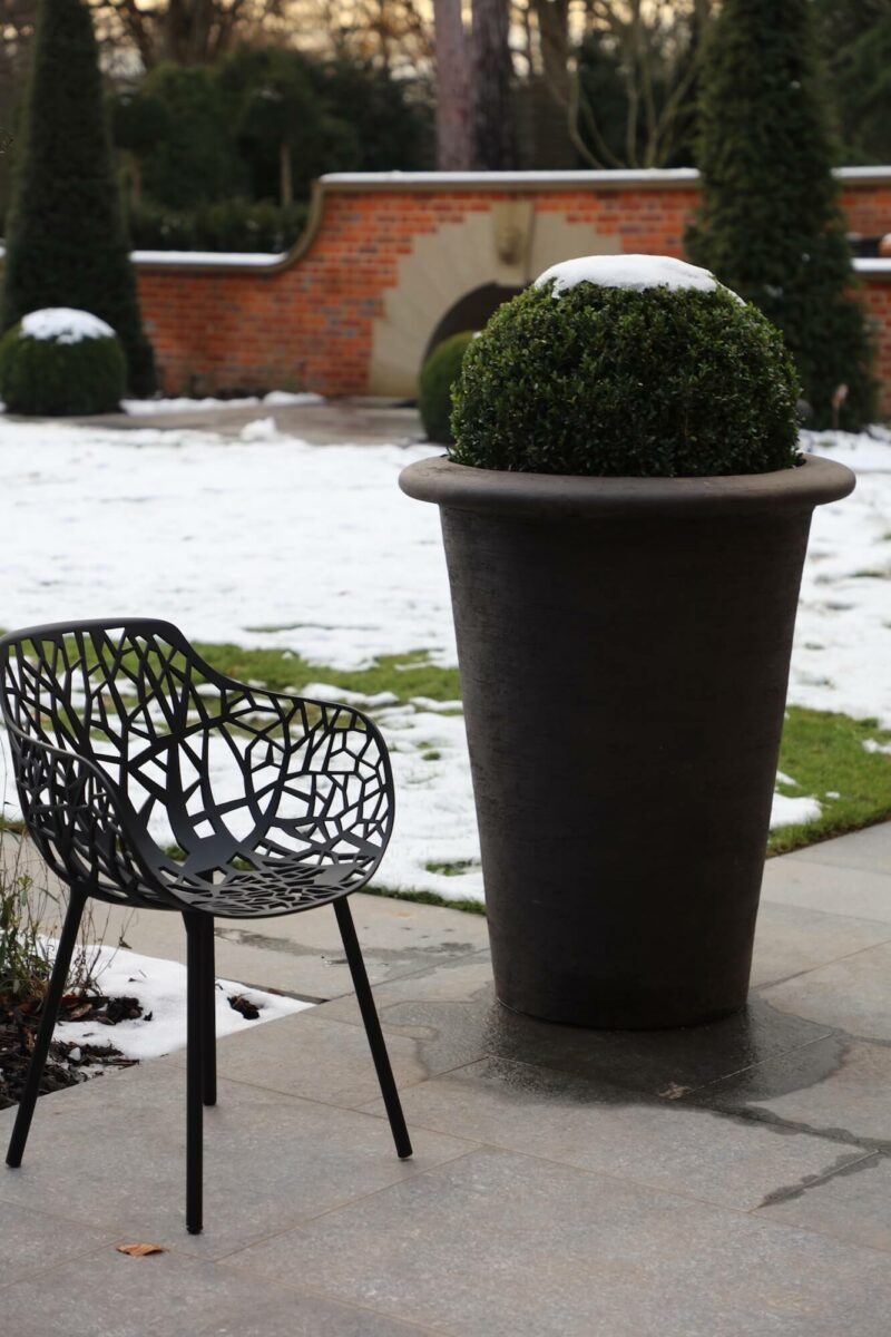 garden leaf chair and giant pot with topiary ball