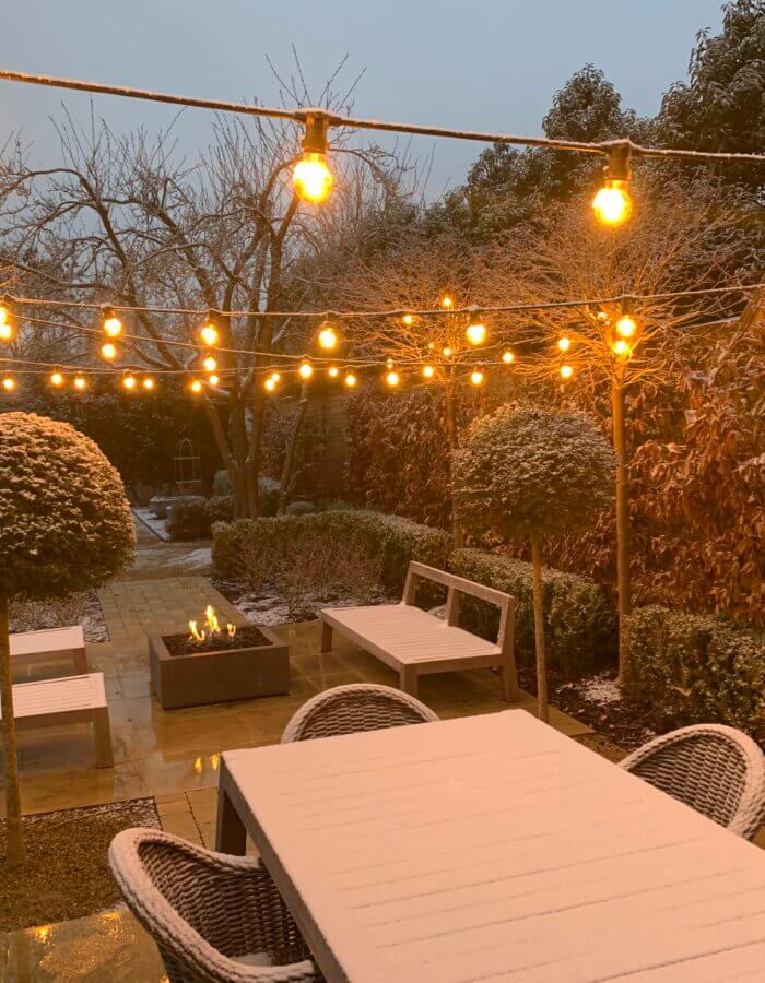 december garden with festoon lighting