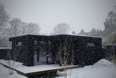 snow falling on home garden office