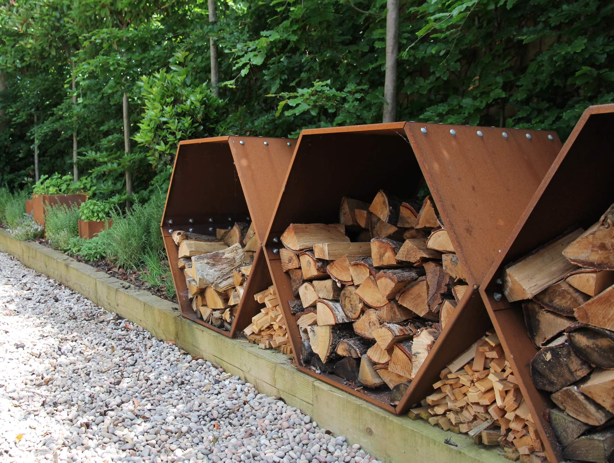 corten beehive logstores and herb garden