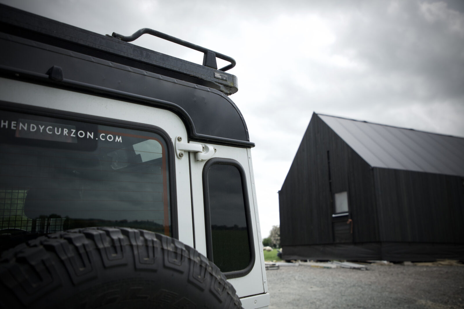 Charlie Luxton black barn in background, Hendy Curzon landscape design land rover in foreground